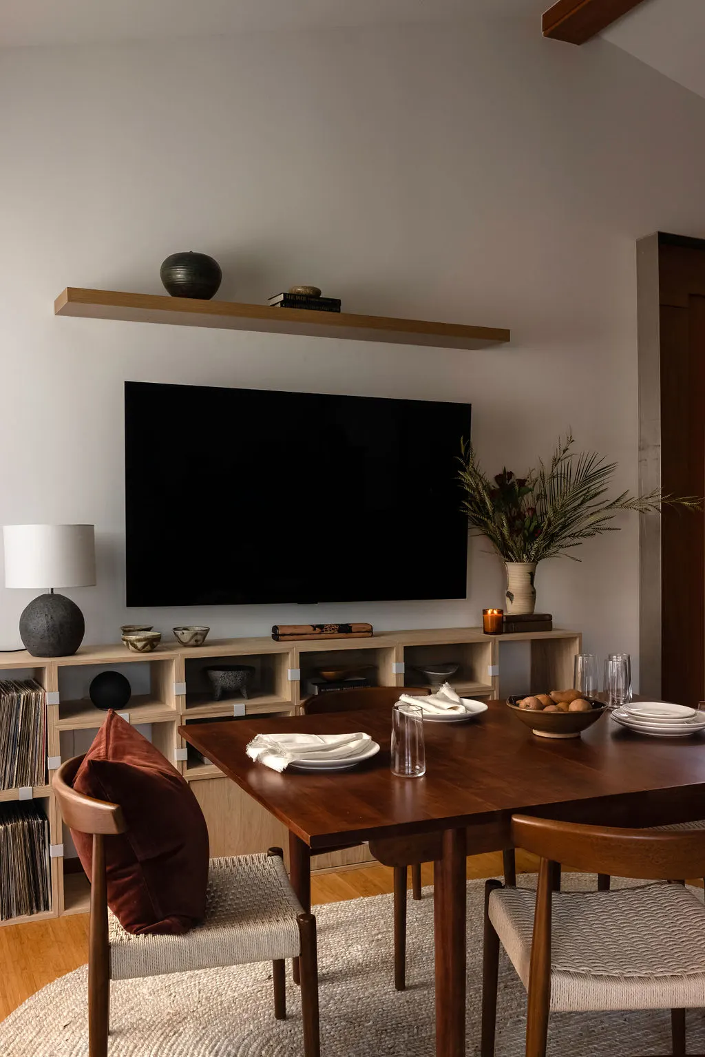 Seattle Townhouse featuring floating oak shelf above tv
