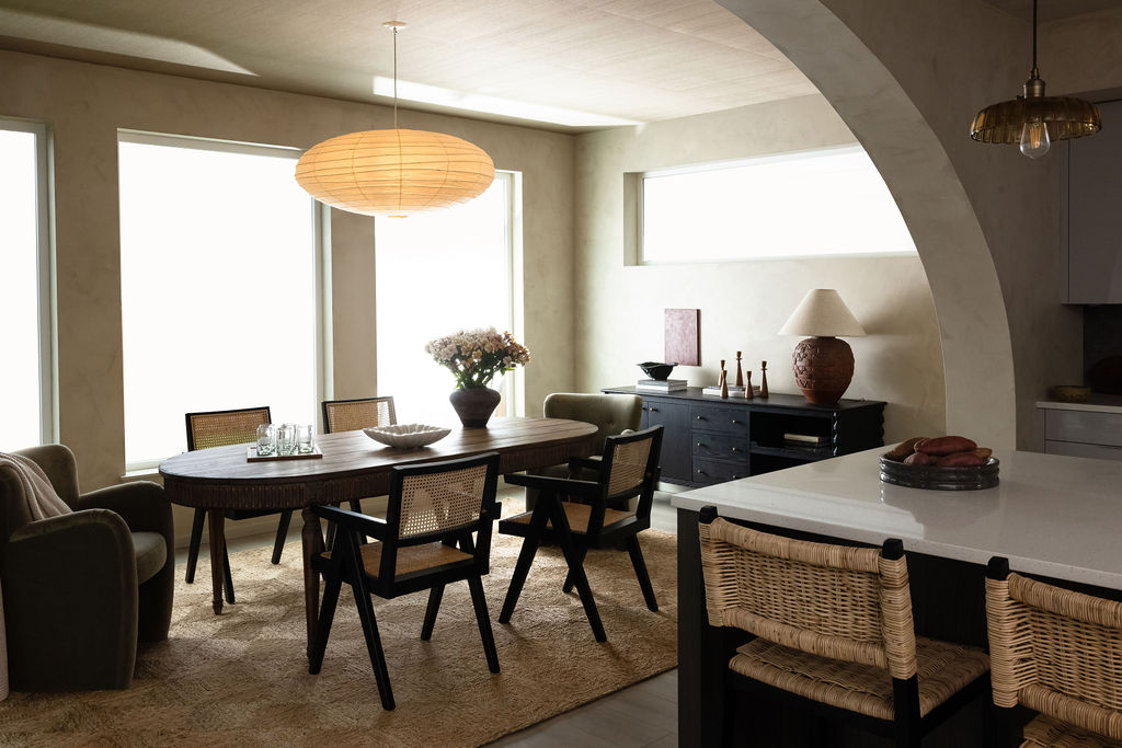 The Timara House featuring arch seperating kitched dining