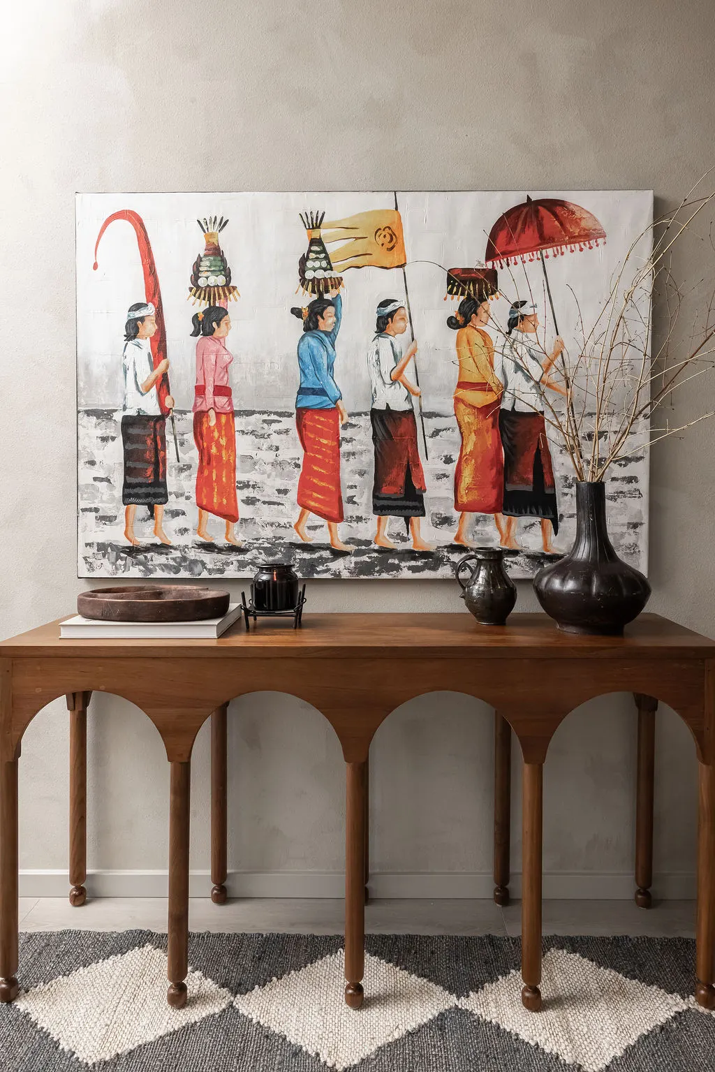 The Timara House featuring balinese art above console table