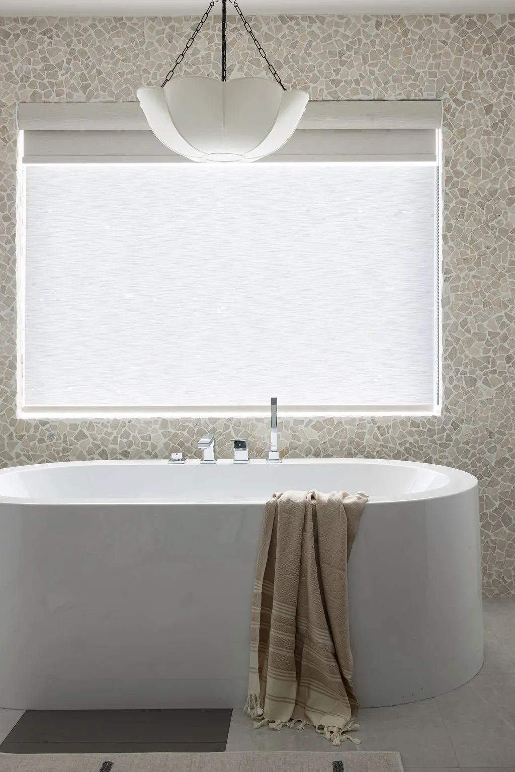 The Timara House detail with pendant above freestanding bathtub