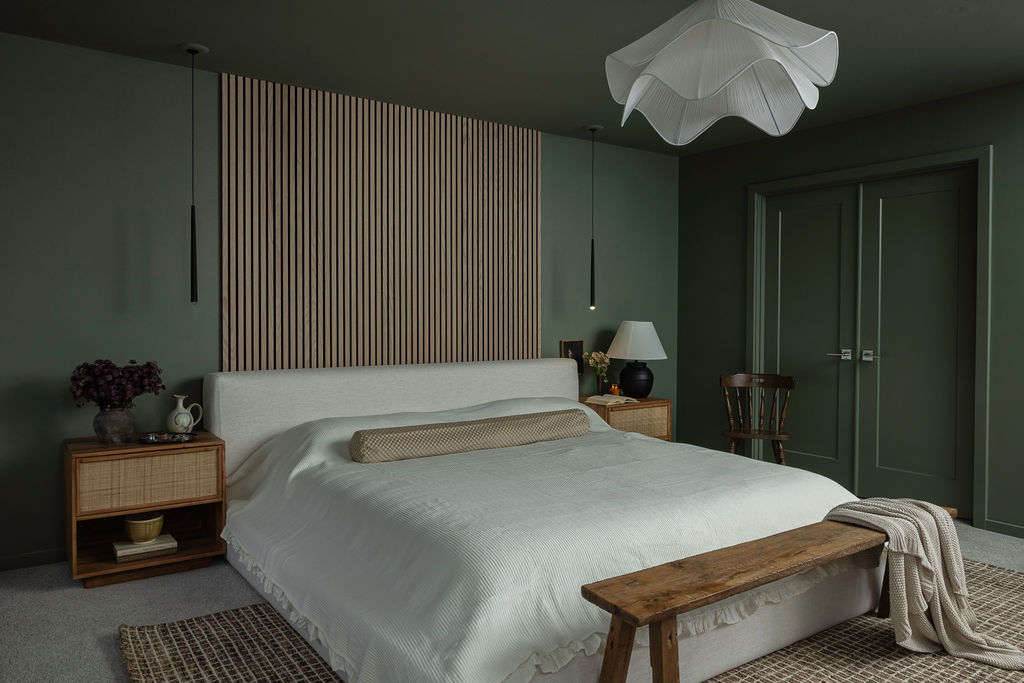 The Timara House detail with slats behind bed green bedroom