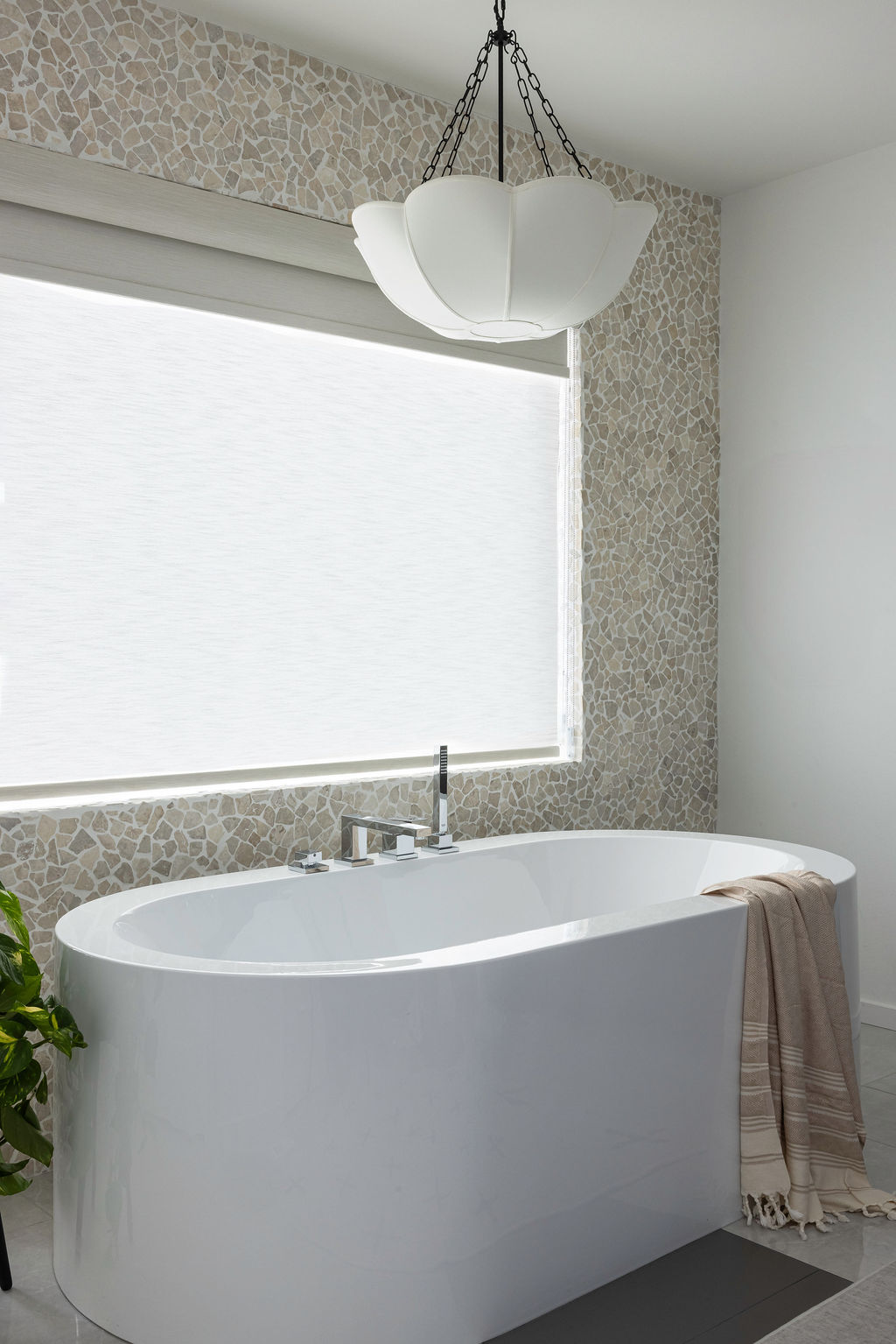 The Timara House featuring tiled wall free standing bathtub