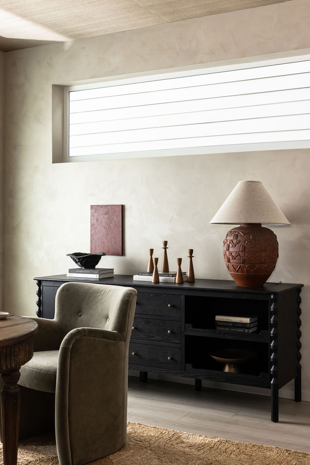 NU Curations interior styling detail featuring vintage lamp on dining buffet