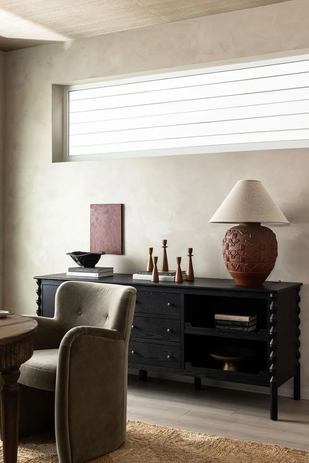 NU Curations interior styling detail featuring vintage lamp on dining buffet